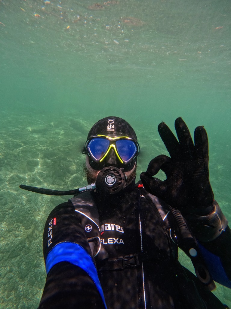 Martin giving an OK sign underwater